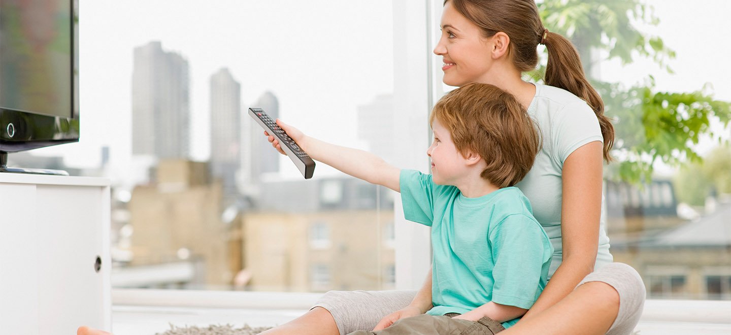 super alkaline battery - mother and son watching tv